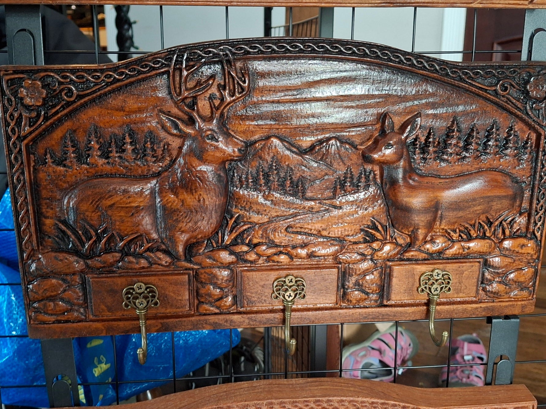 Hand-carved deer key rack with buck and doe relief carving and three brass hooks